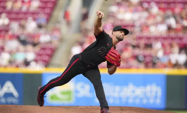 Cincinnati Reds pitcher Nick Martinez throws during the first inning of a baseball game against the Tampa Bay Rays, Friday, July 25, 2025, in Cincinnati. (AP Photo/Jeff Dean)