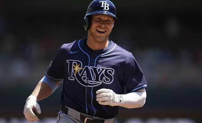 Tampa Bay Rays' Taylor Walls runs the bases after hitting a solo home run during the third inning of a baseball game against the Minnesota Twins, Sunday, July 6, 2025, in Minneapolis. (AP Photo/Abbie Parr)
