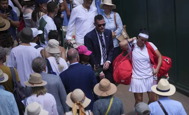 Ons Jabeur of Tunisia leaves the court after her match against Varvara Gracheva of France at the women's first round singles match at the Wimbledon Tennis Championships in London, Monday, June 30, 2025. (AP Photo/Kin Cheung)