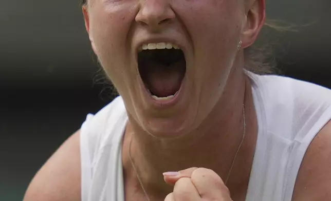 Barbora Krejcikova of Czech Republic celebrates after beating Alexandra Eala of the Philippines in their first round women's singles match at the Wimbledon Tennis Championships in London, Tuesday, July 1, 2025. (AP Photo/Kin Cheung)