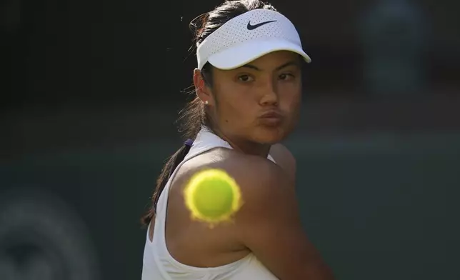 Emma Raducanu of Britain watches the ball during her first round women's single match against Mimi Xu of Britain at the Wimbledon Tennis Championships in London, Monday, June 30, 2025. (AP Photo/Kin Cheung)
