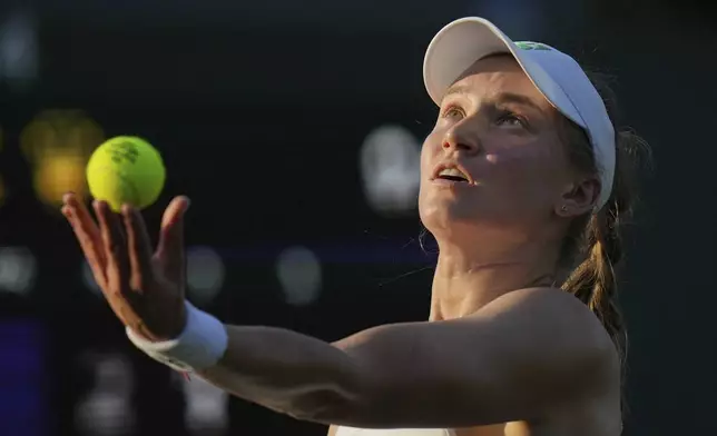 Elena Rybakina of Kazakhstan serves to Elina Avanesyan of Armenia during their first round women's singles match at the Wimbledon Tennis Championships in London, Tuesday, July 1, 2025. (AP Photo/Alastair Grant)