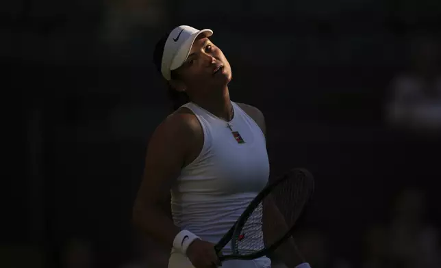 Emma Raducanu of Britain reacts during her first round women's single match against Mimi Xu of Britain at the Wimbledon Tennis Championships in London, Monday, June 30, 2025. (AP Photo/Kin Cheung)