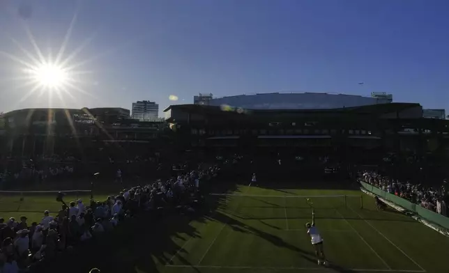 General view as the sun sets at the Wimbledon Tennis Championships in London, Monday, June 30, 2025. (AP Photo/Kirsty Wigglesworth)