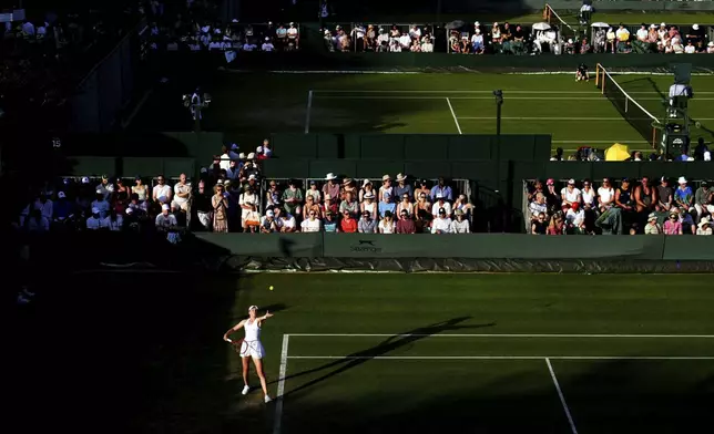 Elena Rybakina of Kazakhstan serves to Elina Avanesyan of Armenia during their first round women’s singles match at the Wimbledon Tennis Championships in London, Tuesday, July 1, 2025. (Mike Egerton/PA via AP)