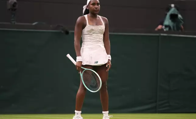 Coco Gauff of the U.S. reacts after losing her first round women's single match against Dayana Yastremska of Ukraine at the Wimbledon Tennis Championships in London, Tuesday, July 1, 2025.(AP Photo/Kirsty Wigglesworth)