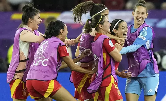 Spain's Aitana Bonmati celebrates with teammates after scoring her sides first goal during the Women's Euro 2025 semifinals soccer match between Germany and Spain at Stadion Letzigrund in Zurich, Switzerland, Wednesday, July 23, 2025. (AP Photo/Martin Meissner)