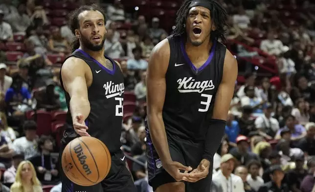 Sacramento Kings' Isaac Jones, right, reacts after a play against the Charlotte Hornets during the second half of an NBA Summer League championship basketball game Sunday, July 20, 2025, in Las Vegas. (AP Photo/John Locher)