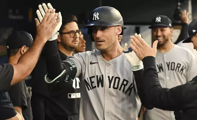 New York Yankees' Cody Bellinger (35) celebrates hitting a solo home run against the Toronto Blue Jays in fifth inning of a baseball game in Toronto on Tuesday, July 22, 2025. (Jon Blacker/The Canadian Press via AP)