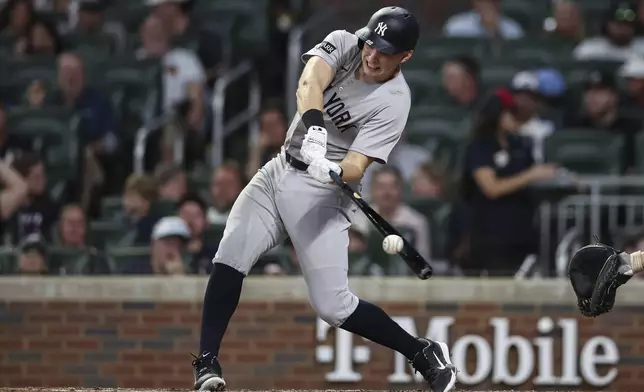 New York Yankees' Ben Rice hits a double in the eighth inning of a baseball game against the Atlanta Braves, Friday, July 18, 2025, in Atlanta. (AP Photo/Colin Hubbard)