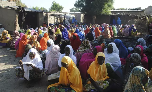 FILE - Women mourn for the death of a family member after a suicide bomb attack in Maiduguri, Nigeria, Thursday, Nov 16, 2017. (AP Photo/Jossy Ola, File)