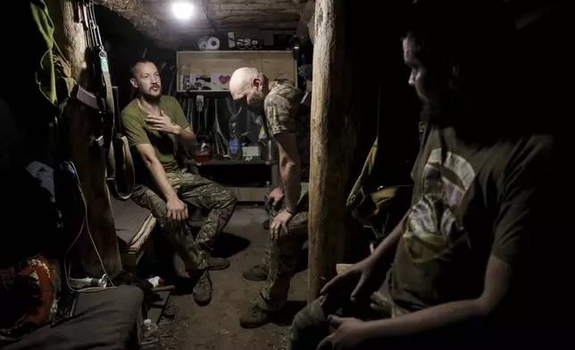 In this photo and provided by Ukraine's 24th Mechanized Brigade press service, soldiers have a rest in a shelter on the frontline near Chasiv Yar, Donetsk region, Ukraine, Tuesday, July 22, 2025. (Oleg Petrasiuk/Ukraine's 24th Mechanized Brigade via AP)