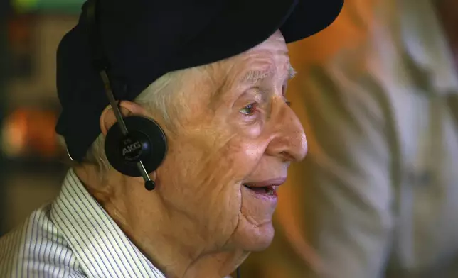 Mario Cirasunda of Orchard Park, N.Y. interacts with one of the museum's touch screen exhibits during a Memory Cafe event at the National Comedy Center Monday, May 5, 2025, in Jamestown, N.Y. (AP Photo/Jeffrey T. Barnes)