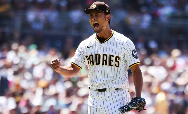 San Diego Padres' Yu Darvish reacts after striking out New York Mets' Mark Vientos to end the sixth inning of a baseball game, Wednesday, July 30, 2025, in San Diego. (AP Photo/Derrick Tuskan)
