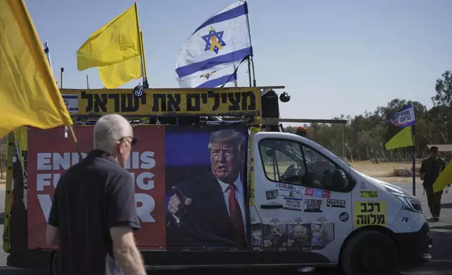 People take part in a protest demanding an end to the war and the immediate release of hostages held by Hamas in the Gaza Strip, at the site of the October 7, 2023 Hamas attack on the Nova music festival near Kibbutz Reim, southern Israel, Wednesday, July 2, 2025. (AP Photo/Ohad Zwigenberg)
