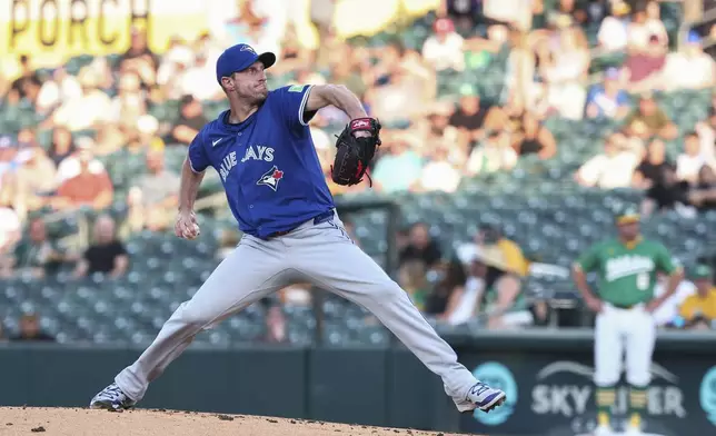 Toronto Blue Jays pitcher Max Scherzer throws to the Athletics during the first inning of a baseball game Friday, July 11, 2025, in West Sacramento, Calif. (AP Photo/Sara Nevis)