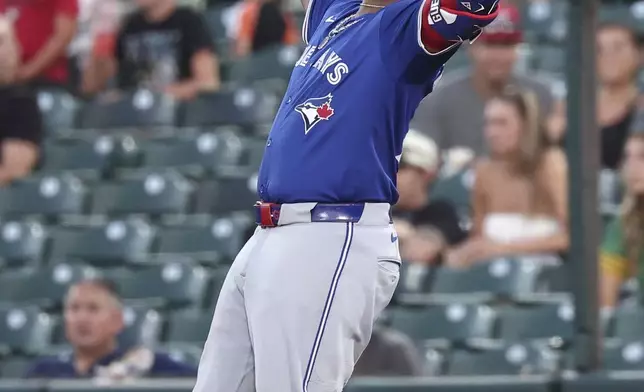 Toronto Blue Jays' Vladimir Guerrero Jr. celebrates after singling in the fifth inning for his 1,000th career hit during a baseball game against the Athletics, Friday, July 11, 2025, in West Sacramento, Calif. (AP Photo/Sara Nevis)
