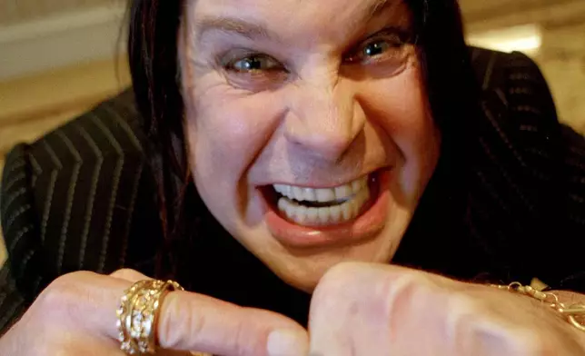 FILE - Heavy metal rock star Ozzy Osbourne poses at the Peninsula Hotel in New York, July 27, 2000. (AP Photo/Jeff Geissler, file)