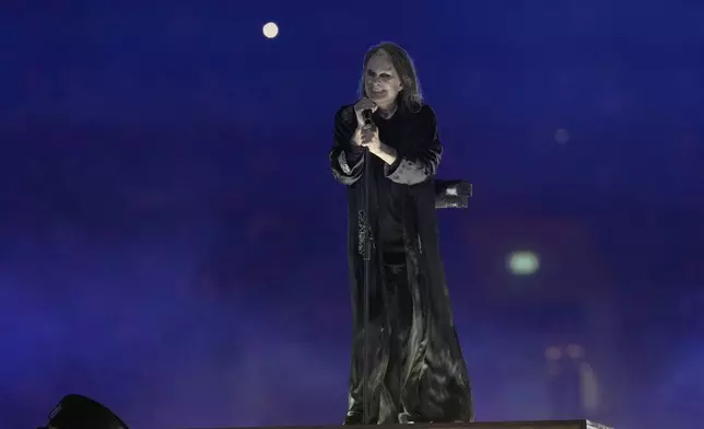 FILE - Ozzy Osbourne performs during the Commonwealth Games closing ceremony at the Alexander stadium in Birmingham, England, Aug. 8, 2022. (AP Photo/Alastair Grant, File)