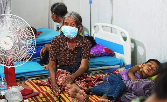 Cambodians villagers stay in a health center as they take refuge in Wat Phnom Kamboar In Oddar Meanchey province, Cambodia, Sunday, July 27, 2025, amid the fighting between Thailand and Cambodia. (AP Photo/Heng Sinith)