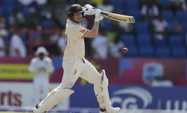 Australia's Steve Smith plays a shot against West Indies on day three of the second cricket Test match at the National Cricket Stadium in St. George's, Grenada, Saturday, July 5, 2025. (AP Photo/Ricardo Mazalan)