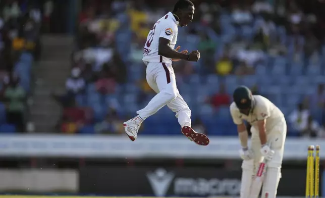 West Indies' Shamar Joseph celebrates taking the wicket of Australia's Travis Head on day three of the second cricket Test match at the National Cricket Stadium in St. George's, Grenada, Saturday, July 5, 2025. (AP Photo/Ricardo Mazalan)