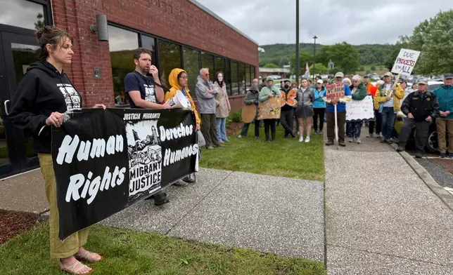 Protesters hold a rally outside a U.S. Immigration and Customs Enforcement office in St. Albans, Vt., on Friday, June 20, 2025, in support of Wuendy Bernardo, a migrant dairy farmworker at risk of deportation. (AP Photo/Amanda Swinhart)