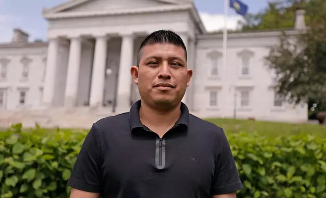 Dairy farmworker José Molina-Aguilar stands outside the Vermont Statehouse after a rally for housing rights for migrant farmworkers in Montpelier, Vt., on Friday, June 13, 2025. (AP Photo/Amanda Swinhart)