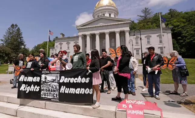 Members of Migrant Justice, a community group advocating for migrant farmworkers' rights, hold a rally outside the Vermont Statehouse in Montpelier, Vt., on Friday, June 13, 2025. (AP Photo/Amanda Swinhart)