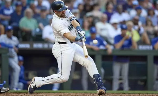 Seattle Mariners' Cal Raleigh hits a solo home run off Kansas City Royals pitcher Daniel Lynch IV during the seventh inning of a baseball game Monday, June 30, 2025, in Seattle. (AP Photo/John Froschauer)