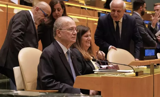 Palestine Prime Minister Mohammed Mustafa, foreground, arrives to address the United Nations General Assembly, Monday, July 28, 2025. (AP Photo/Richard Drew)