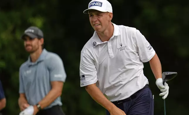 Sam Stevens watches his tee shot on the 11th hole during the first round of the 3M Open golf tournament at the Tournament Players Club Thursday, July 24, 2025, in Blaine, Minn. (AP Photo/Abbie Parr)