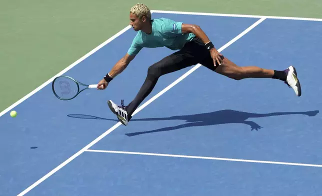Gabriel Diallo, of Canada, returns the ball to Matteo Gigante, of Italy, during a match at the National Bank Open men’s tennis tournament, Wednesday, July 30, 2025, in Toronto. (Nathan Denette/The Canadian Press via AP)