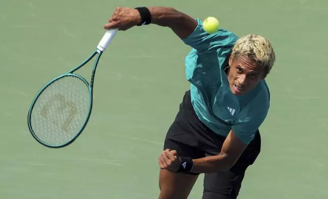 Gabriel Diallo, of Canada, serves to Matteo Gigante, of Italy, during a match at the National Bank Open men’s tennis tournament, Wednesday, July 30, 2025, in Toronto. (Nathan Denette/The Canadian Press via AP)