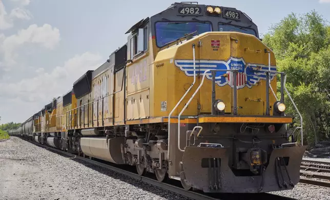 FILE - A Union Pacific train travels through Union, Neb., July 31, 2018. (AP Photo/Nati Harnik, File)