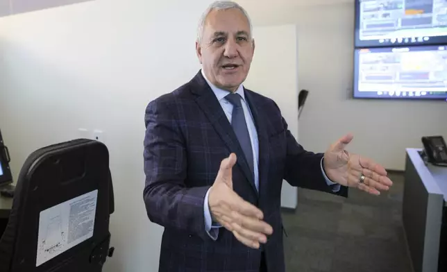 FILE - Union Pacific CEO Jim Vena talks in front of a locomotive simulator used to train engineers at the company's headquarters in Omaha, Neb., Dec. 15, 2023. (AP Photo/Josh Funk, File)