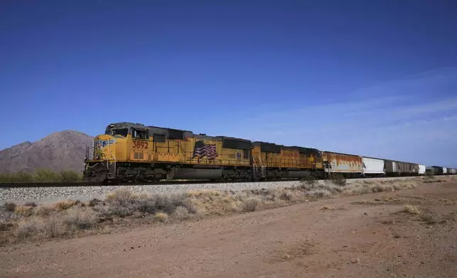 FILE - A Union Pacific freight train travels along the tracks Thursday, April 17, 2025, in Eloy, Ariz. (AP Photo/Ross D. Franklin, File)