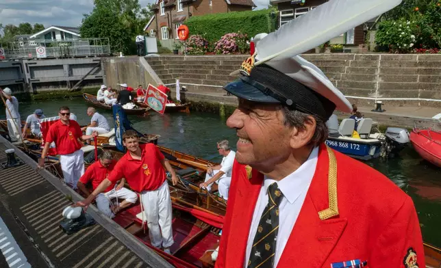 The Sovereign's Swan Marker, David Barber, is seen during the ancient tradition of Swan Upping, the annual census of the mute swan population on the River Thames in London, Monday, July 14, 2025.(AP Photo/Thomas Krych)