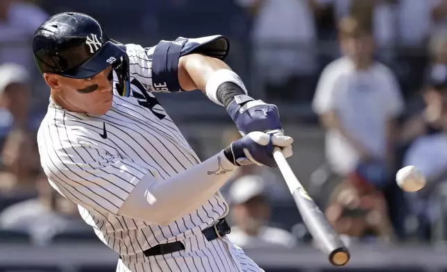 New York Yankees' Aaron Judge hits a two-run home run during the seventh inning of a baseball game against the Athletics, Sunday, June 29, 2025, in New York. (AP Photo/Adam Hunger)