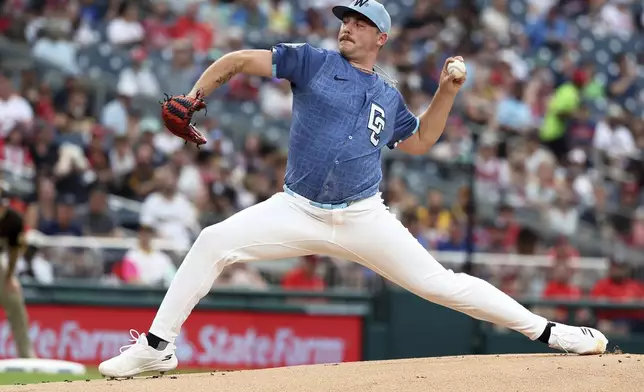 Washington Nationals pitcher Mitchell Parker throws during the first inning of a baseball game against the San Diego Padres, Saturday, July 19, 2025, in Washington. (AP Photo/Daniel Kucin Jr.)