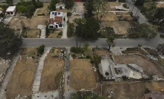 Lots sit empty after the homes were destroyed in the Eaton Fire in Altadena, Calif., Wednesday, June 4, 2025. (AP Photo/Jae C. Hong)