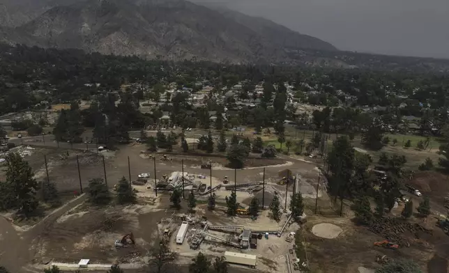 A recycling facility occupies a golf course in Altadena, Calif., Wednesday, June 4, 2025, where debris from wildfires is processed. (AP Photo/Jae C. Hong)
