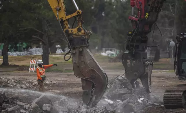 Debris from January wildfires is processed at a recycling facility set up on a golf course in Altadena, Calif., Wednesday, June 4, 2025. (AP Photo/Jae C. Hong)