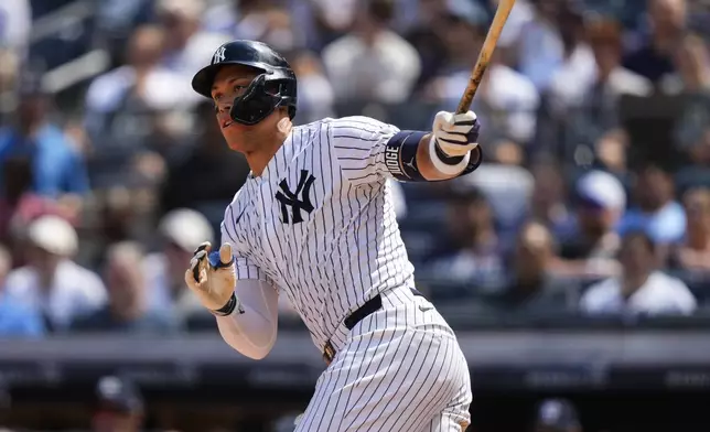 New York Yankees' Aaron Judge (99) hits a double during the seventh inning of a baseball game against the Chicago Cubs, Saturday, July 12, 2025, in New York. (AP Photo/Yuki Iwamura)