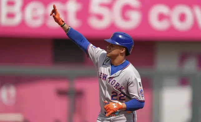 New York Mets' Juan Soto celebrates after hitting a two-run home run during the fourth inning of a baseball game against the Kansas City Royals, Saturday, July 12, 2025, in Kansas City, Mo. (AP Photo/Charlie Riedel)
