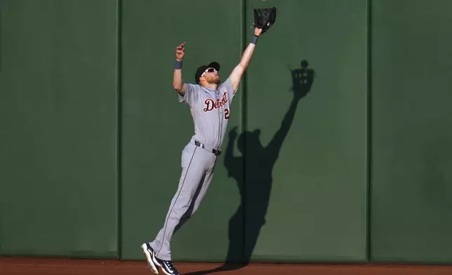 Detroit Tigers outfielder Parker Meadows leaps to make a catch at the centerfield wall on a fly ball hit by Pittsburgh Pirates' Henry Davis off pitcher Jack Flaherty during the second inning of a baseball game in Pittsburgh, Monday, July 21, 2025. (AP Photo/Gene J. Puskar)