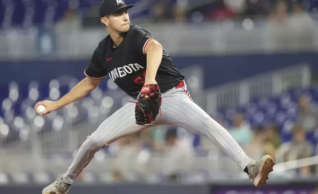 Minnesota Twins starting pitcher David Festa throws during the first inning of a baseball game against the Miami Marlins, Thursday, July 3, 2025, in Miami. (AP Photo/Lynne Sladky)