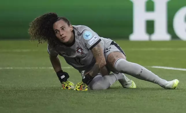 Portugal goalkeeper Patricia Morais gets upi from the pitch after failing to make a save during the Women's Euro 2025, group B, soccer match between Portugal and Belgium at Stade de Tourbillon in Sion, Switzerland, Friday, July 11, 2025. (AP Photo/Alessandra Tarantino)