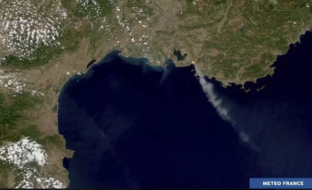 This satellite photo, provided by Meteo-France, shows smoke billowing due to wildfires near Marseille, southern France, Tuesday, July 8, 2025. (Meteo-France /NOAA via AP)