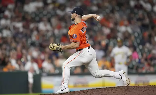 Houston Astros' Cooper Hummel pitches against the Athletics during the ninth inning of a baseball game Friday, July 25, 2025, in Houston. (AP Photo/David J. Phillip)